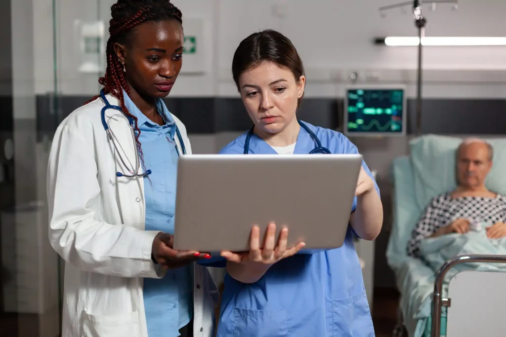 african-american-doctor-and-nurse-using-laptop-in-2023-11-27-04-51-57-utc-scaled