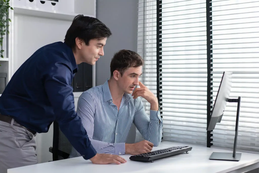 businessman-with-colleague-brainstorming-work-on-c-2023-11-27-05-06-22-utc-scaled