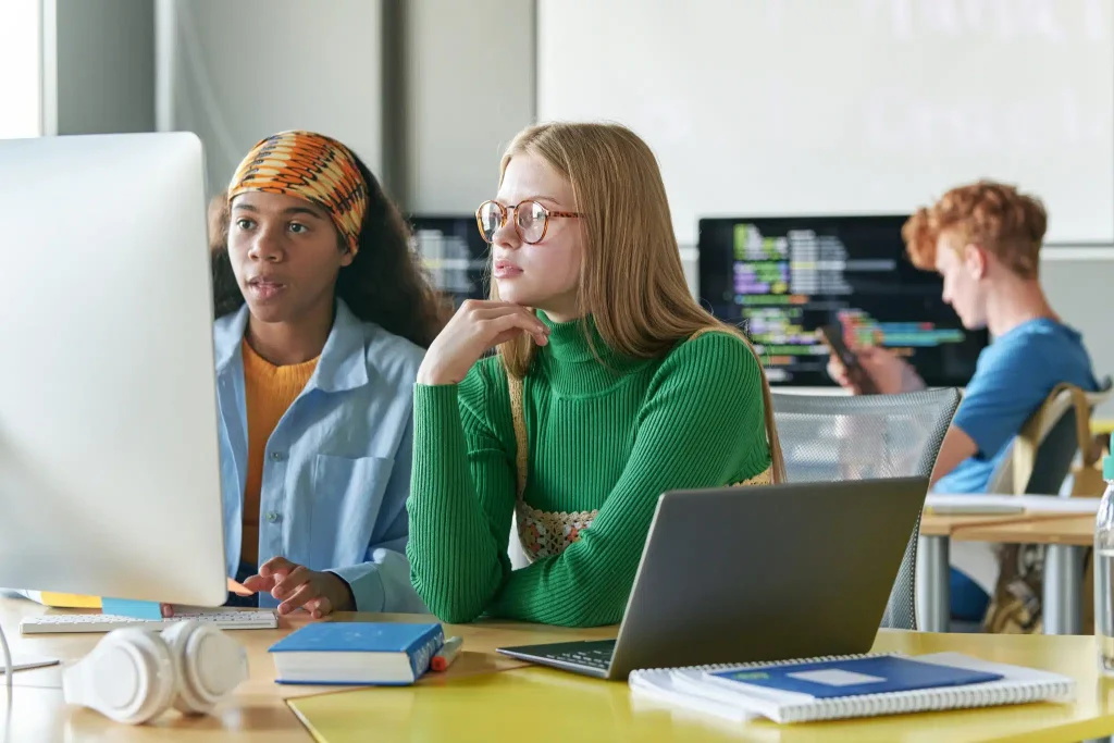 girls-working-with-online-presentation-on-computer-2023-11-27-05-03-28-utc-scaled
