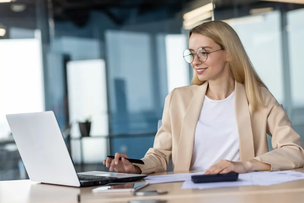 portrait-of-smiling-young-business-woman-bank-emp-2023-11-27-05-11-28-utc-scaled