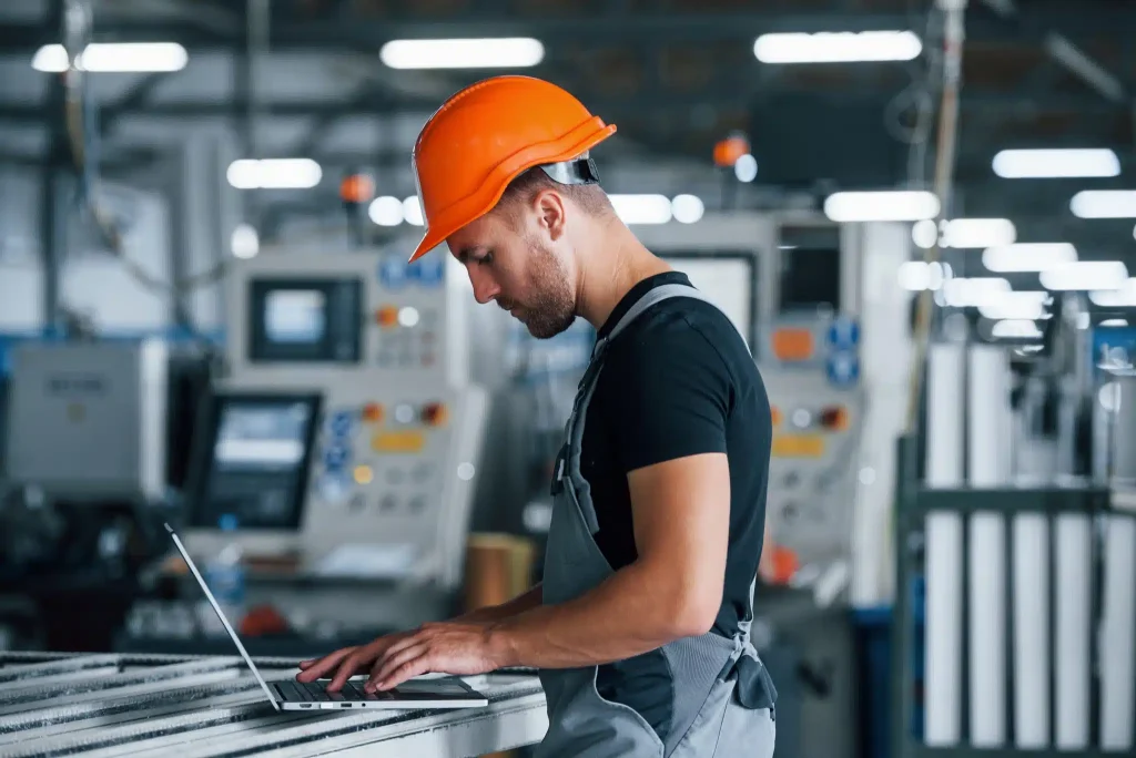 typing-on-keyboard-industrial-worker-indoors-in-f-2023-11-27-05-35-49-utc-scaled
